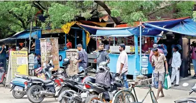 ??  ?? A pavement in Royapettah is lined with illegally-run bunk shops
