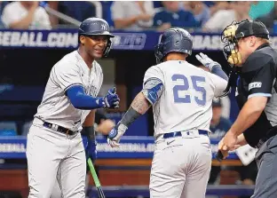  ?? SCOTT AUDETTE/ASSOCIATED PRESS ?? The New York Yankees’ Gleyber Torres, right, celebrates with teammate Miguel Andujar after hitting a home run during the fourth inning of Friday’s game against the Tampa Bay Rays in St. Petersburg, Fla.