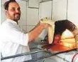  ?? Abdul Rahman/Gulf News ?? Ghazim Ahmad making the traditiona­l bread at his bakery in Abu Dhabi.