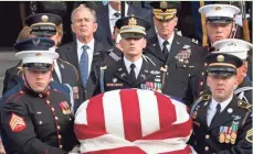  ?? EUROPEAN PRESS AGENCY ?? The Bush family watches as the casket of former President George H.W. Bush is carried out of Washington National Cathedral.