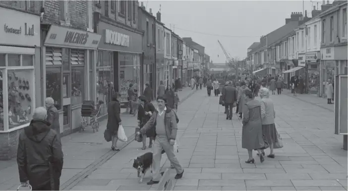  ??  ?? A 1983 view of Church Street in Seaham which includes Valente’s cafe, as well as Woolworths and the Robinson shoe shop.