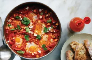  ?? (Photos: NYT) ?? (Above) Shakshuka with feta, in New York. (Above-right) Winter squash with wild mushroom curry. The majority of these recipes will deliver a whole meal in a single pot, pan or skillet.