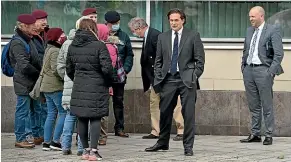  ?? GETTY IMAGES ?? Conservati­ve MP and former defence minister Johnny Mercer, second from right, speaks to a group of veterans and their supporters as the trial of two paratroope­r veterans accused of murdering Official IRA member Joe McCann in 1972 collapses in Belfast.