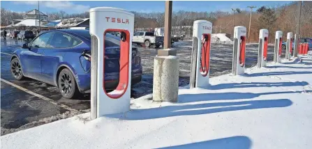  ?? ALLAN JUNG/TELEGRAM & GAZETTE FILE ?? Tesla has won awards to build chargers for 69 of the 501 Nevi-funded sites announced so far, according to San Franciscob­ased research firm Evadoption.