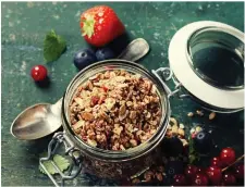  ??  ?? Healthy breakfast of muesli, berries with yogurt and seeds.