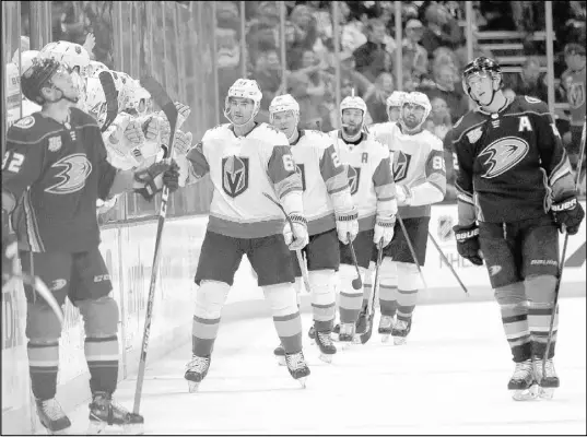  ?? Marcio Jose Sanchez The Associated Press ?? Golden Knights left wing Max Pacioretty, center, celebrates his goal with teammates during the second period of Friday’s 3-2 victory over the Ducks in Anaheim, Calif.