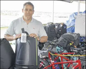  ?? DAVID JALA/SALTWIRE NETWORK ?? One Ocean Expedition­s managing director Andrew Prossin, who grew up in the Sydney area, stands amid a deck full of golf clubs and bicycles. Prossin is presently aboard the Akademik Ioffe, an expedition cruise ship that is on its inaugural Fiddles and...