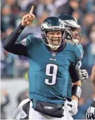  ??  ?? Eagles quarterbac­k Nick Foles celebrates Sunday after throwing one of his three touchdown passes against the Vikings. GEOFF BURKE/USA TODAY SPORTS