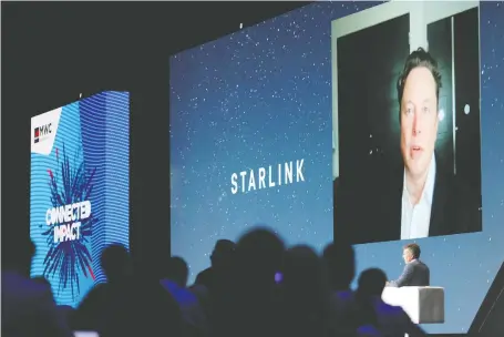  ?? NACHO DOCE/REUTERS ?? Spacex founder and Tesla CEO Elon Musk, speaking via video link during the Mobile World Congress in Barcelona, forecast total investment costs in the satellite internet business at as much as US$30 billion.