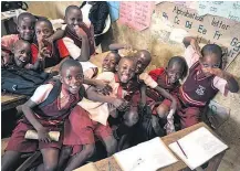  ?? Picture / AP ?? School children in Uganda: Growing literacy has been one of the world’s great success stories.