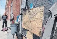  ?? JOHN RENNISON THE HAMILTON SPECTATOR ?? A cardboard memorial to Terry Lucas, who died of a drug overdose last week, was placed outside a shelter on York Boulevard.