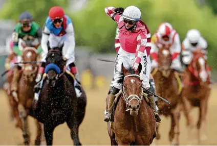  ?? Patrick Smith / Getty Images ?? Jockey Flavien Prat celebrates as Rombauer wins the 146th Preakness Stakes on Saturday at Pimlico Race Course in Baltimore.