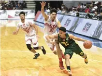  ??  ?? GUARD WENDELL COMBOY rose for the FEU Tamaraws in the end yesterday to help his team halt a three-game losing streak.