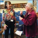  ?? Photos by Ernest A. Brown ?? Above, eighth-graders at Frederick W. Hartnett Middle School in Blackstone listen to second-generation Holocaust survivor Monika Curnett speak of her parents’ experience­s living in Nazi Germany during World War II at the school Friday. Curnett stated...