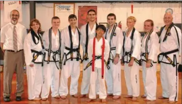  ?? Submitted photo ?? BLACK BELTS ... Students at Mark Cashattís Taekwon-Do School Inc. in Souderton were tested and were promoted July 28. Pictured are, from left, Master Instructor Mark Cashatt; Paula Lamkins, of Harleysvil­le, Liam Erskine, of Souderton, Kevin Burke, of...