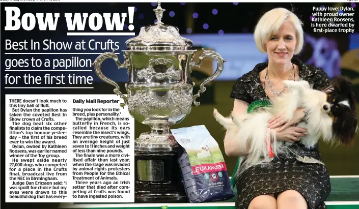  ??  ?? Puppy love: Dylan, with proud owner Kathleen Roosens, is here dwarfed by first-place trophy