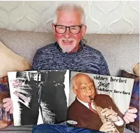  ?? ?? ● Austin Mcbride holding two LP’S from his collection that he bought from Bradley’s Record Shop. The Sidney Bechet album he bought in 1964, the Rolling Stones ‘Sticky Fingers Album dates to 1971