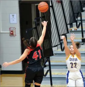  ?? PILOT PHOTO/RON HARAMIA ?? Emma Hepler tries to get this three-pointer off against Oregon-davis during a game last week. The Lady Trojans have two more games this week.