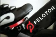  ?? JEFF CHIU — THE ASSOCIATED PRESS FILE ?? Peloton’s logo on one of its exercise bikes. The company’s loss widened in its fiscal third quarter and sales continued to slow as the company contends with a further cooling of the exercise-at-home trend. Shares fell sharply Tuesday.