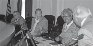  ?? Diane Wagner, File ?? This file photo shows then Floyd County Elections Board member Tom Rees (from left), chairman Steve Miller and member Mardi Haynes-jackson being briefed by County Attorney Wade Hoyt before a meeting in 2018.