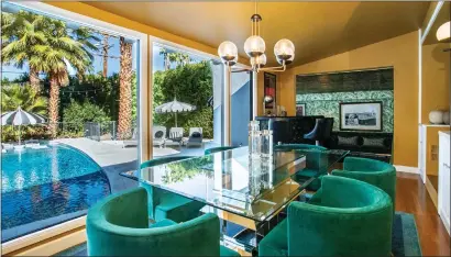  ?? PHOTOS BY DANIEL RYAN — DANIEL JAMES RYAN PHOTOGRAPH­Y ?? The dining room of the Palm Spring estate, on the market for $2.2million.