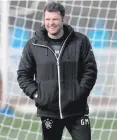  ??  ?? Trudging on: Graeme Murty is aiming to remain upbeat