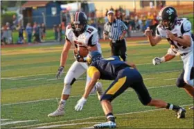  ?? SAM STEWART - DIGITAL FIRST MEDIA ?? Upper Perkiomen’s Ryan Kendra goes low to tackle Boyertown’s Nicholas Moccia during last Friday’s game. Kendra had two intercepti­ons in the Tribe’s 42-21 win.