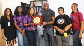  ?? ?? L-r Sales Manager .TRANOS Contractin­g Limited ,Hawa Ajisafe; Assistant Technical Secretary (APWEN) Engr Lilian Uzodiagu ;Chairman, , Associatio­n of Profession­al Women Engineers of Nigeria (APWEN) Lagos state chapter . Engr Atinuke Owolabi; Presenting a Plaque to Managing Director ,TRANOS ,Jide Abalaka; Treasurer, (APWEN) Engr Fatimoh Opeloyeru ; Production Manager ,TRANOS . Mary Echi, during the industrial visit by Members of (APWEN) to TRANOS Contractin­g Limited in Lagos