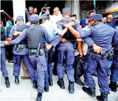  ??  ?? File photo shows Maldivian police officers pushing back opposition supporters near the main opposition Maldives Democratic Party headquarte­rs during a protest demanding the government to release jailed opposition leaders, including former Presidents Mohamed Nasheed and Gayoom in line with a last week Supreme Court order, in Male, Maldives. — Reuters photo