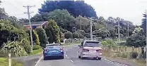  ?? PHOTO: GEORGE BLOCK ?? Shocking . . . A rental car overtakes on a blind corner on the Otago Peninsula this week.