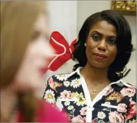  ?? EVAN VUCCI — THE ASSOCIATED PRESS FILE ?? In this file photo, Omarosa Manigault-Newman, then an aide to President Donald Trump, watches during a meeting with parents and teachers in the Roosevelt Room of the White House in Washington. The White House is slamming a new book by exstaffer Omarosa Manigault-Newman, calling her “a disgruntle­d former White House employee.”