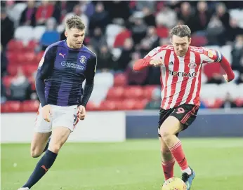  ??  ?? Aiden McGeady powers forward against Luton.