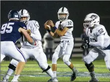  ?? Special to NWA Democrat-Gazette/DAVID BEACH ?? Dalton McDonald (center) of Bentonvill­e West runs back into the pocket against Springdale Har-Ber as Trenton Davis (right) and Franky Sanchez protect him Friday at Wildcat Stadium in Springdale.