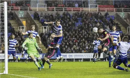  ??  ?? Jack Harrison heads in from Helder Costa’s deflected cross to take Leeds top of the Championsh­ip at Reading. Photograph: Andrew Kearns/CameraSpor­t via Getty Images