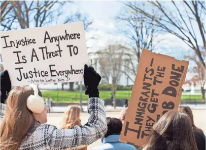  ??  ?? Demonstrat­ors gather near the White House on Saturday to protest President Trump’s travel ban. TASOS KATOPODIS, AFP/GETTY IMAGES