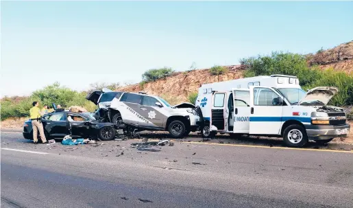  ?? ARIZONA DEPARTMENT OF PUBLIC SAFETY/2020 ?? A Tesla crashed into a police vehicle in Cochise County, Arizona, causing it to hit an ambulance.