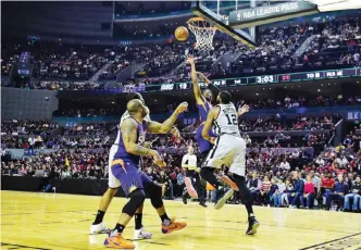  ??  ?? MEXICO CITY: Phoenix Suns’ T.J. Warren (C) vies for the ball with San Antonio Spurs’ LaMarcus Aldridge (R), during an NBA Global Games match at the Mexico City Arena, on Saturday, in Mexico City. — AFP