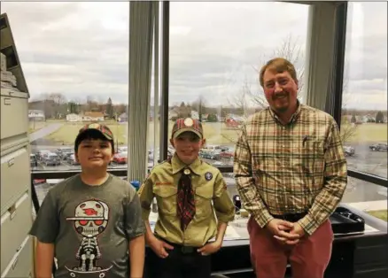  ?? PHOTO PROVIDED ?? From left, Stockbridg­e Valley 4th graders and Munnsville Pack 7members Wyatt Douthit and Tim Bernet meet with Madison County Planning Department Director Scott Ingmire.