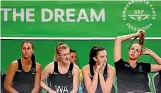  ??  ?? Silver Ferns Ameliarann­e Ekenasio, left, Shannon Francois, Bailey Mes and Kelly Jury look on from the bench during the loss to England.