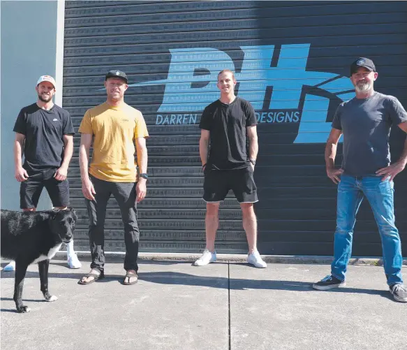  ?? Picture: AFL ?? AFL stars Travis Boak (left) and Nat Fyfe (rear), tour the DHD facility with Mick Fanning and Darren Handley before ordering new surfboards this week.