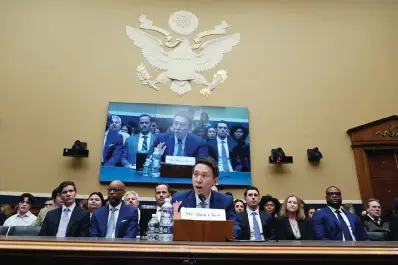  ?? The Associated Press ?? ■ TikTok CEO Shou Zi Chew testifies during a hearing of the House Energy and Commerce Committee, on the platform’s consumer privacy and data security practices and impact on children Thursday on Capitol Hill in Washington. Chew’s rare public appearance came at a crucial time for the company, which has 150 million American users but is under increasing pressure from U.S. officials. TikTok and its Chinese parent company, ByteDance, have been swept up in a wider geopolitic­al battle between Beijing and Washington over trade and technology.