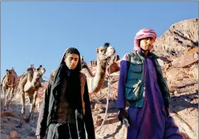  ?? REUTERS ?? Bedouin mountain guides make their way down from the summit of Mount Moses, near the city of Saint Catherine, in the Sinai Peninsula, south of Egypt, in December 2015.