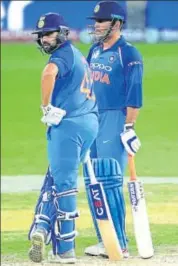  ?? AP ?? It remains to be seen if Rohit Sharma (left) sends MS Dhoni to bat at No 4 again on Sunday.