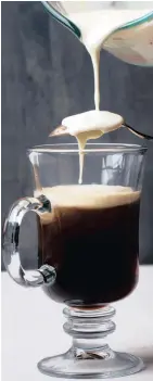  ?? Picture: THE WASHINGTON POST ?? SPOONFUL OF GOODNESS: Carefully add the cream to the top of an Irish coffee. :