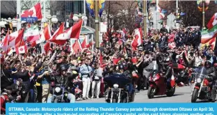  ?? — AFP ?? OTTAWA, Canada: Motorcycle riders of the Rolling Thunder Convoy parade through downtown Ottawa on April 30, 2022. Two months after a trucker-led occupation of Canada’s capital, police said bikers planning another antiestabl­ishment protest would be blocked from parading their motorcycle­s near Parliament.