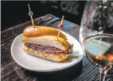  ??  ?? Bocadillos is one of the specialtie­s at La Taberna, including one made with house-cured brisket ($7).