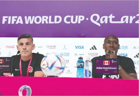  ?? NATHAN DENETTE/THE CANADIAN PRESS ?? Canada head coach John Herdman and captain Atiba Hutchinson speak during a news conference Tuesday ahead of Wednesday's match against Belgium at the World Cup in Doha, Qatar. The midfielder will be appearing in his 99th game in a Team Canada jersey.