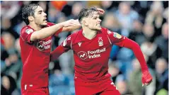  ??  ?? Late to the party: Matty Cash (right) celebrates his superb injury-time strike for Forest