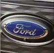  ?? David Zalubowski / Associated Press ?? Ford has told dealership­s they must invest thousands for charging stations in order to sell electric vehicles.