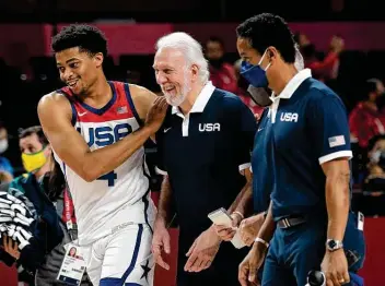  ?? Eric Gay / Associated Press ?? Keldon Johnson, left, and Gregg Popovich returned to San Antonio as Olympic gold medal winners. Popovich led the U.S. men’s basketball team to a victory over France in the championsh­ip game.